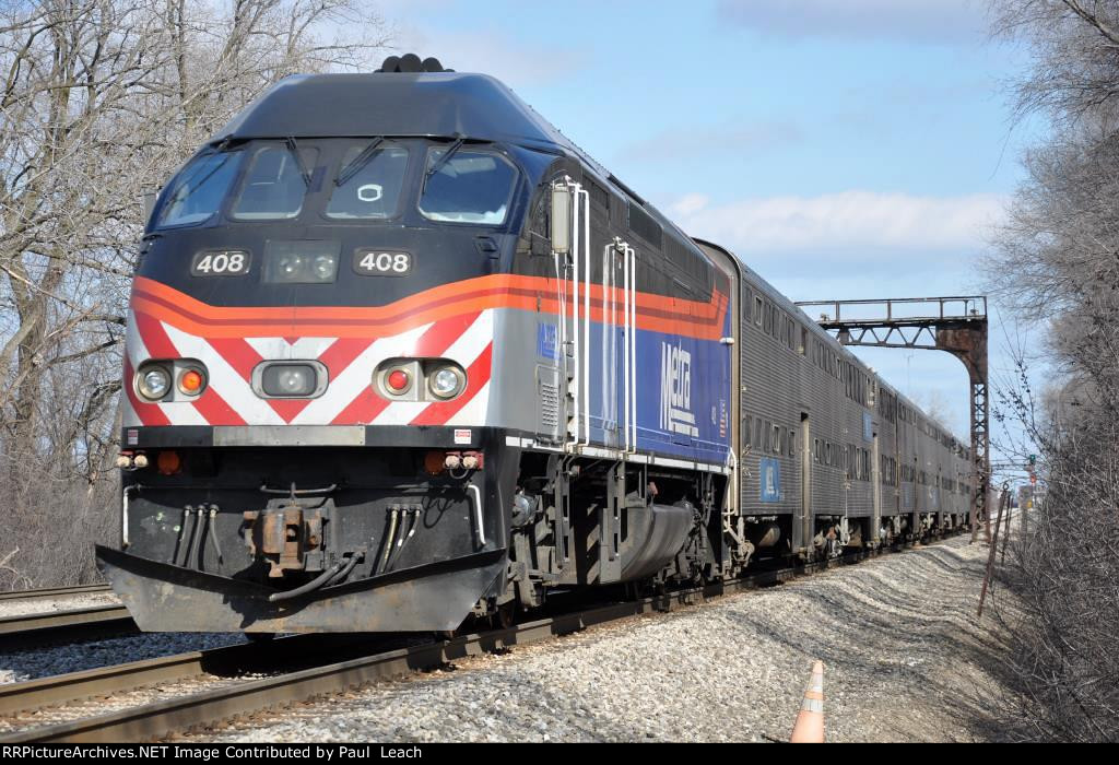 Inbound commuter out of its station stop